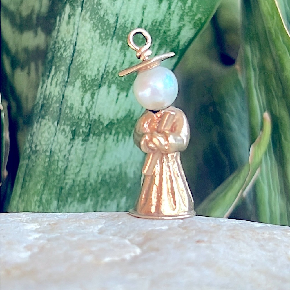 14 karat gold charm can be worn as pendant or bracelet